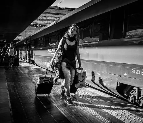 woman walking on train platform